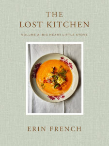 A cookbook cover with soup in a floral bowl and the title “The Lost Kitchen Volume 2” by Erin French.