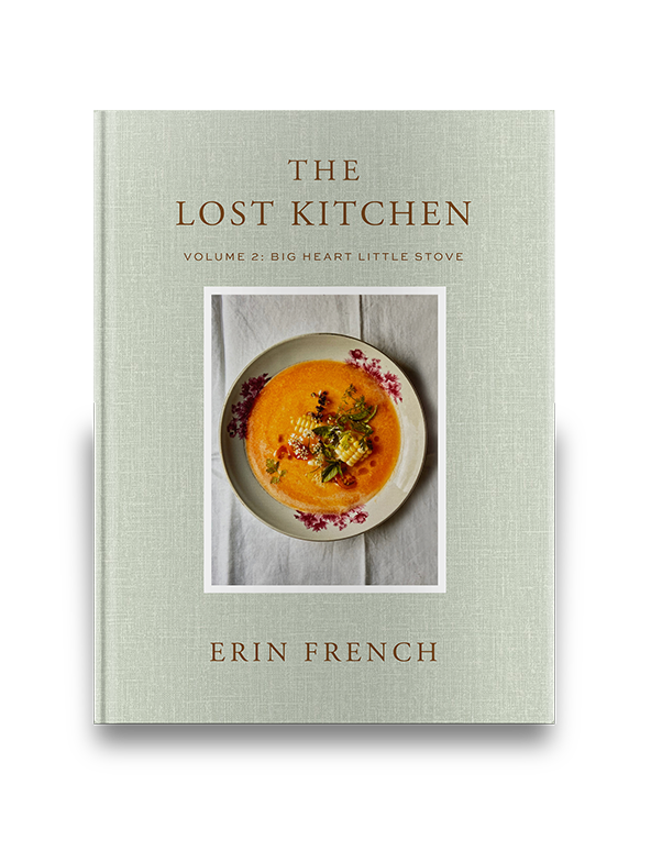 Cookbook cover titled "The Lost Kitchen" with a floral dish of soup on a pale green background.
