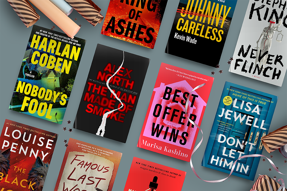 Nine colorful book covers arranged on a green surface with gift wrap and ribbon decorations scattered around.