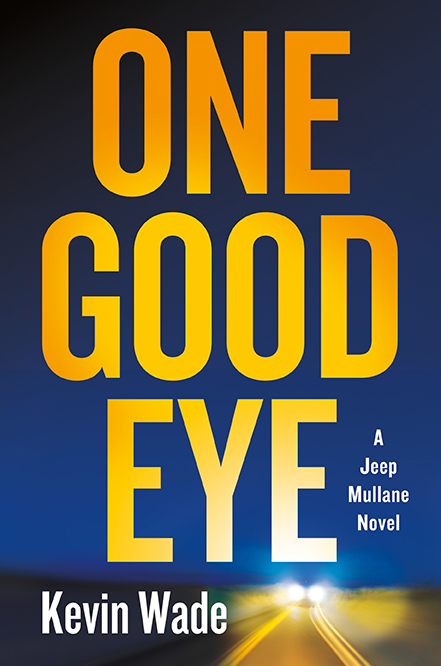 Book cover for "One Good Eye" by Kevin Wade, with a blurred highway at night below bold yellow title text.