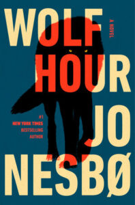 Book cover for "Wolf Hour" by Jo Nesbø, showing a black wolf silhouette with bold, large yellow and red text.