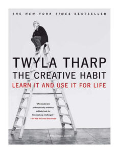 Book cover: "The Creative Habit" by Twyla Tharp, shows a woman sitting on top of a ladder, black-and-white design.