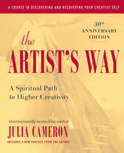 Book cover of "The Artist's Way" by Julia Cameron with a mountain illustration in the background.
