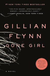 Black cover of "Gone Girl" by Gillian Flynn, with light pink text and strands of hair on the left side.