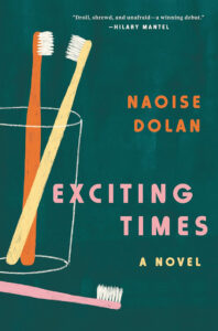 Book cover showing two toothbrushes in a glass, one toothbrush outside, with the title "Exciting Times" by Naoise Dolan.
