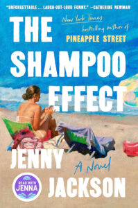 A woman sits on a beach under a blue sky; "The Shampoo Effect" by Jenny Jackson is written in bold text.