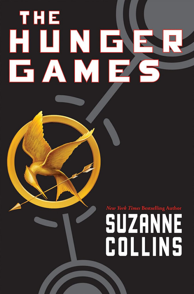 The Hunger Games book cover with a gold mockingjay pin and bold white and red title text.