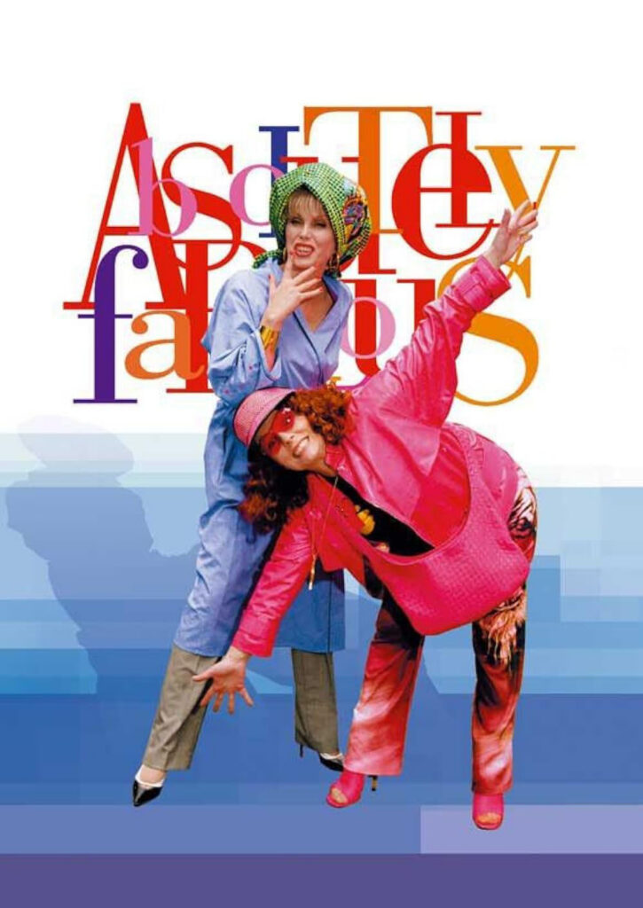 Two women in colorful outfits pose playfully in front of overlapping text reading "Absolutely Fabulous.