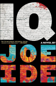 Book cover for “IQ” by Joe Ide, white brick letters over colorful cityscape and blood spatter on “Q”.