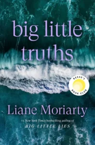Aerial view of ocean waves, “big little truths” book cover by Liane Moriarty with Reese’s Book Club sticker.