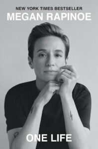 Book cover of “One Life” by Megan Rapinoe, featuring a black-and-white portrait of the author.